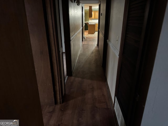 hallway featuring dark wood-type flooring