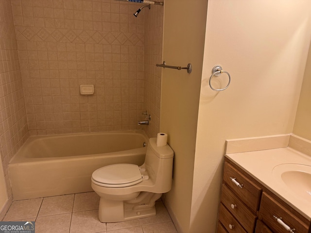 full bathroom with tile patterned flooring, vanity, toilet, and tiled shower / bath combo