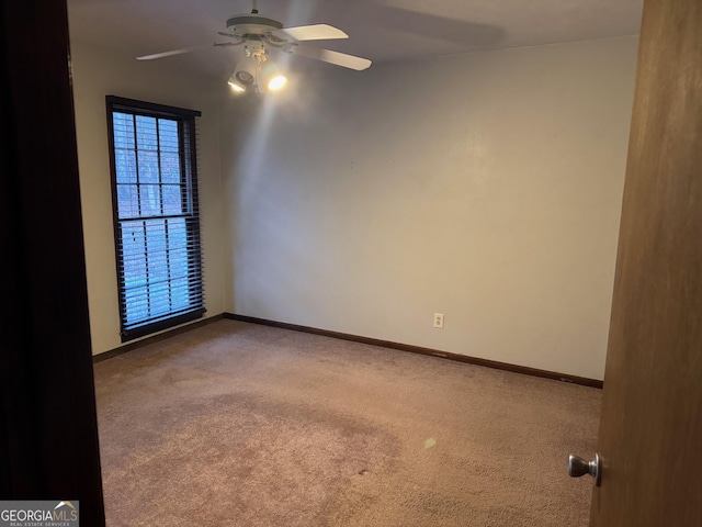 carpeted empty room with ceiling fan