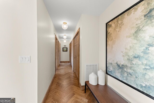 corridor featuring light parquet floors