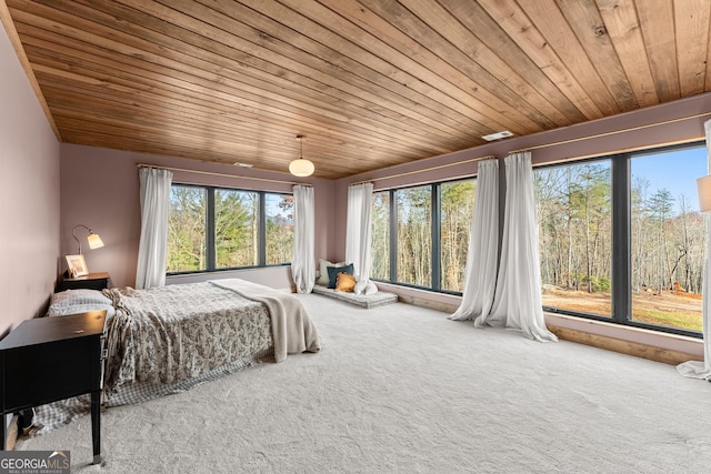 carpeted bedroom with wooden ceiling