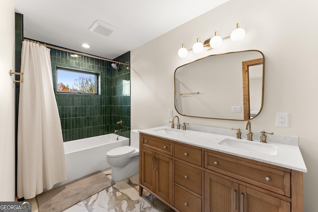 full bathroom with vanity, toilet, and shower / tub combo