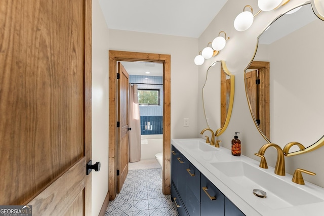 bathroom with toilet and vanity