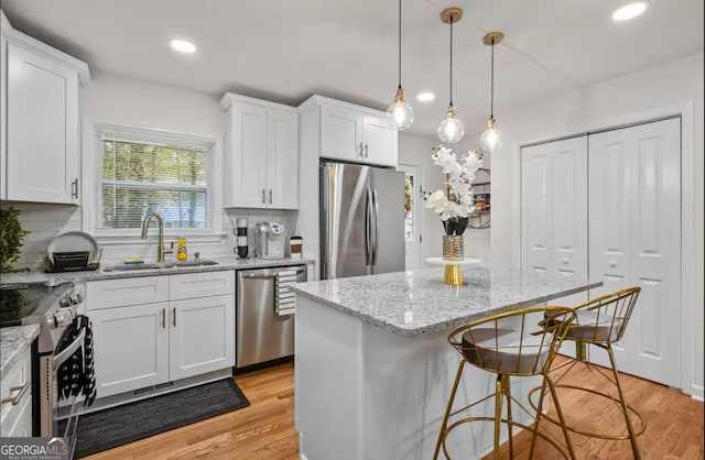 kitchen featuring white cabinetry and stainless steel appliances