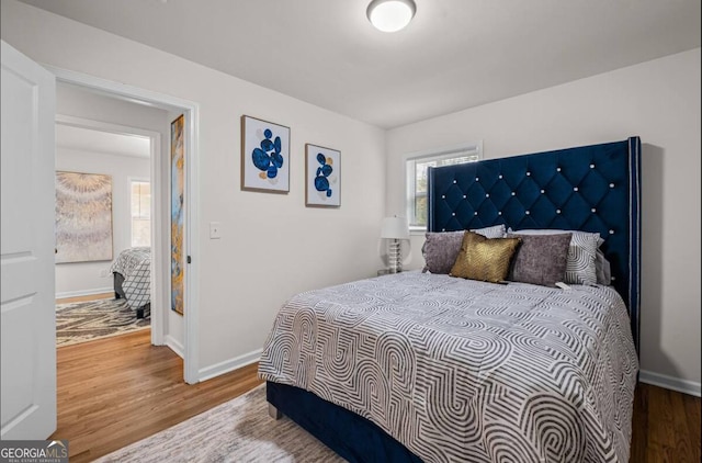 bedroom featuring hardwood / wood-style floors