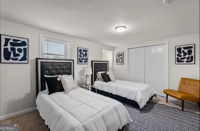 carpeted bedroom featuring a closet