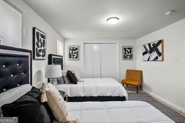 bedroom featuring carpet and a closet