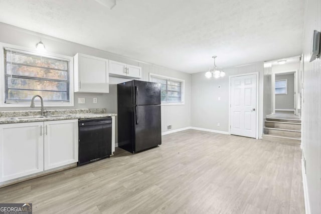 kitchen featuring black appliances, white cabinetry, sink, and light hardwood / wood-style flooring