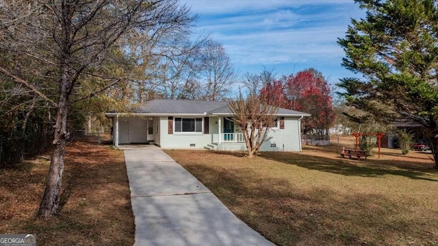 single story home featuring a front lawn, covered porch, and a carport