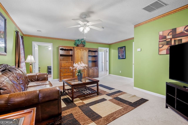 carpeted living room featuring a textured ceiling, ceiling fan, and crown molding