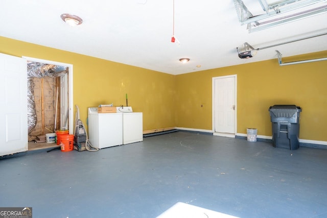 garage with a garage door opener and washer and clothes dryer