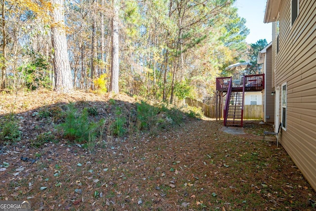 view of yard featuring a wooden deck