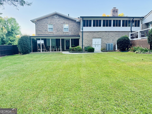 back of house with a yard