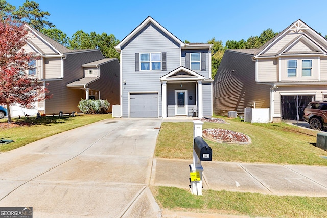 view of front of property featuring a front lawn and a garage