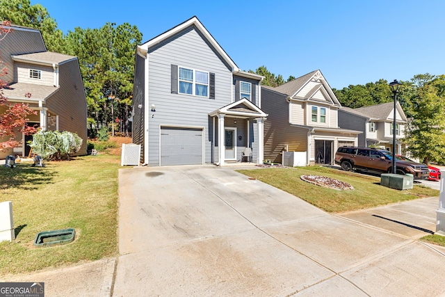 view of front facade featuring a garage and a front yard