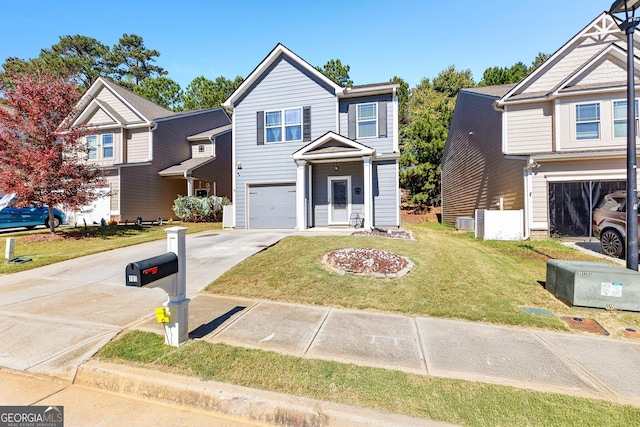 view of front of house featuring a garage and a front lawn