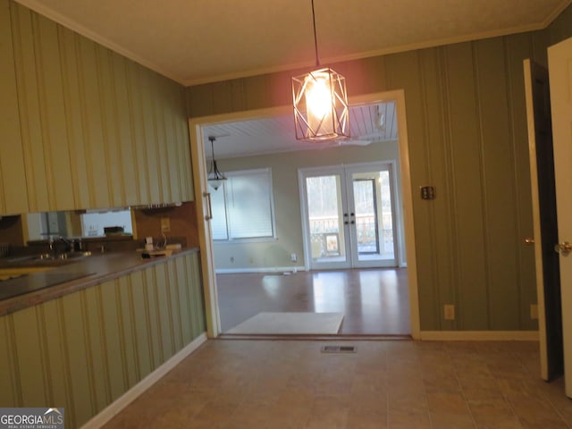 kitchen with sink, french doors, pendant lighting, and ornamental molding