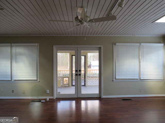 interior space with ceiling fan, french doors, wood ceiling, and dark hardwood / wood-style floors