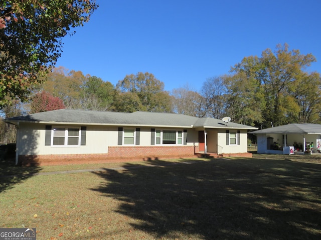 ranch-style home with a front yard