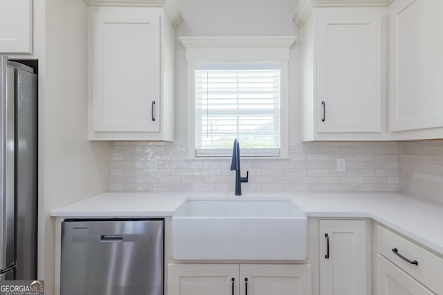 5704 Payton Pl, Lake Park, GA 31636 - kitchen with white cabinetry, a sink, tasteful backsplash, and appliances with stainless steel finishes