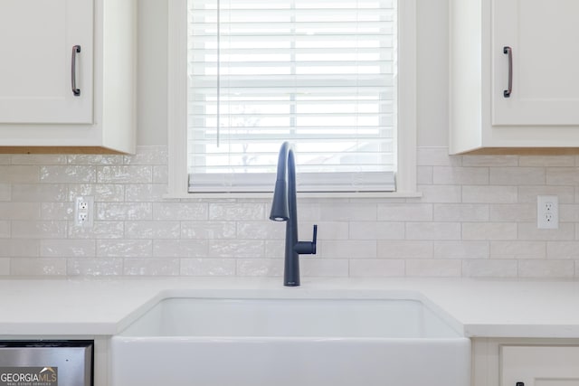 5704 Payton Pl, Lake Park, GA 31636 - interior details featuring white cabinetry, light countertops, a sink, and tasteful backsplash