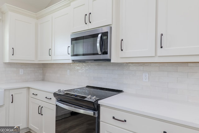 5704 Payton Pl, Lake Park, GA 31636 - kitchen with electric range oven, light countertops, decorative backsplash, and stainless steel microwave