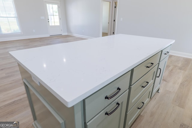 5704 Payton Pl, Lake Park, GA 31636 - kitchen featuring a center island, baseboards, light wood-type flooring, and gray cabinetry