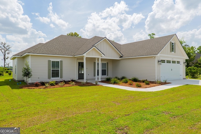 5704 Payton Pl, Lake Park, GA 31636 - view of front facade with roof with shingles, board and batten siding, and a front yard