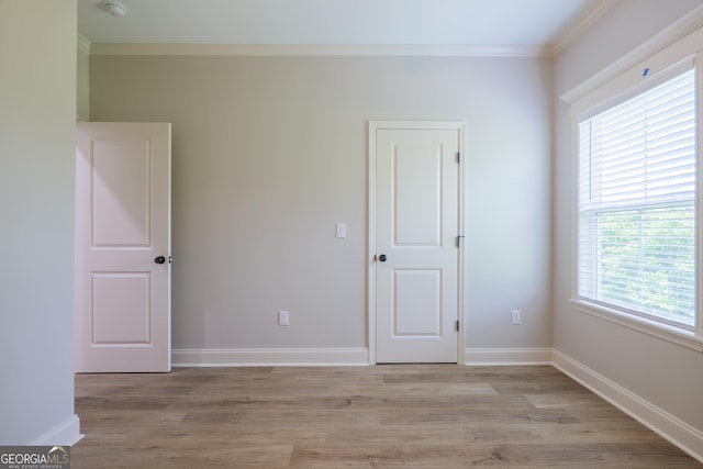 5704 Payton Pl, Lake Park, GA 31636 - empty room featuring baseboards, crown molding, and light wood-style flooring