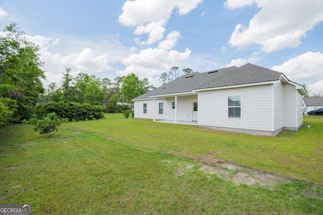5704 Payton Pl, Lake Park, GA 31636 - rear view of house with a lawn, a patio, and roof with shingles
