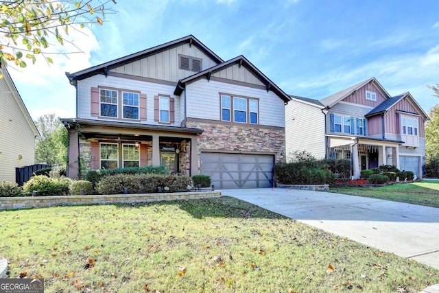 craftsman inspired home with a front yard and a garage