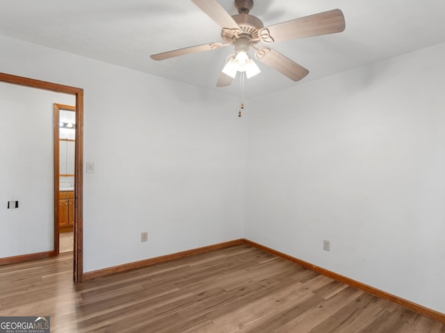 unfurnished room with wood-type flooring and ceiling fan