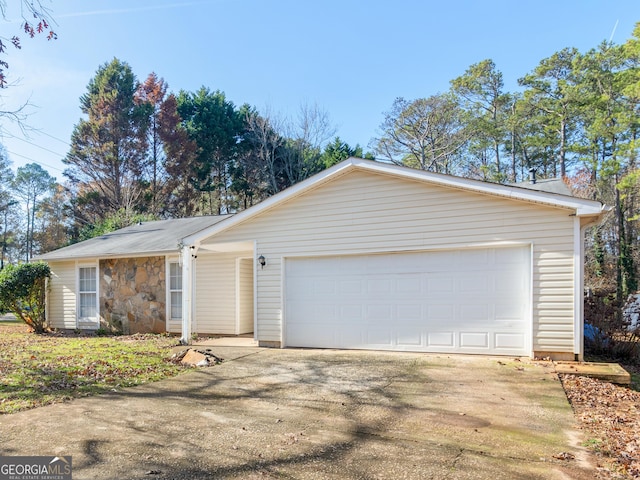 ranch-style home with a garage