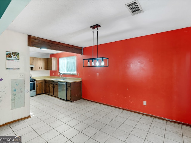 kitchen with beam ceiling, sink, stainless steel appliances, pendant lighting, and light tile patterned flooring