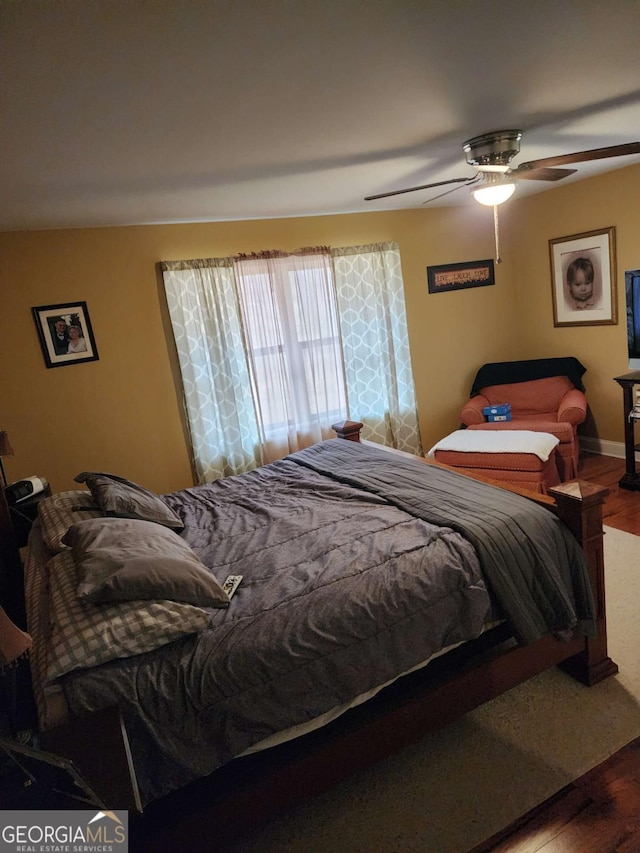 bedroom featuring ceiling fan and wood-type flooring