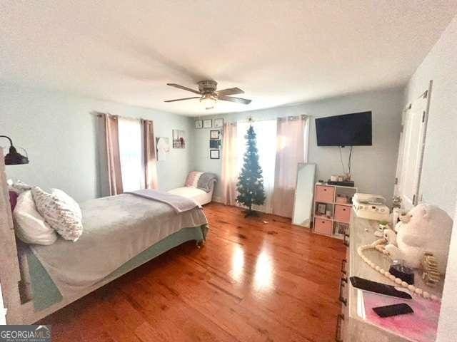 bedroom featuring ceiling fan and hardwood / wood-style floors