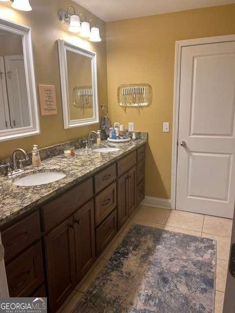 bathroom with vanity and tile patterned floors