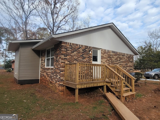 view of home's exterior featuring a deck