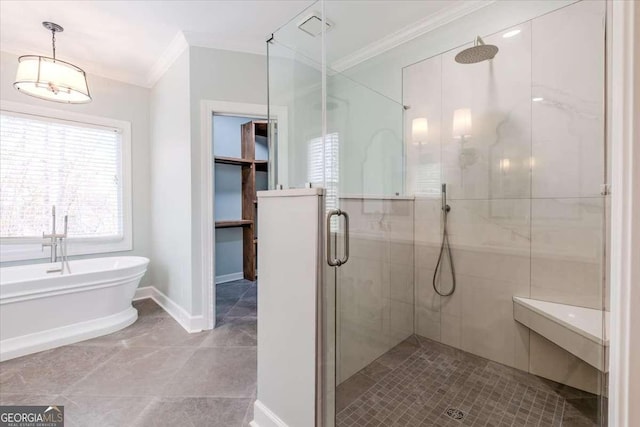 bathroom with ornamental molding and independent shower and bath