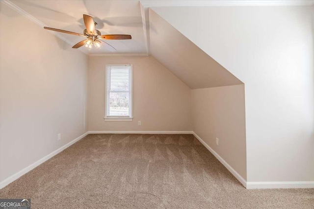 bonus room featuring ceiling fan, carpet floors, and vaulted ceiling