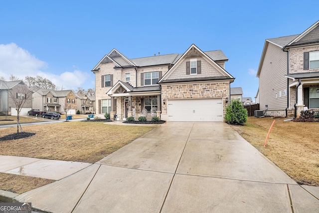 craftsman-style house with a garage and a front yard