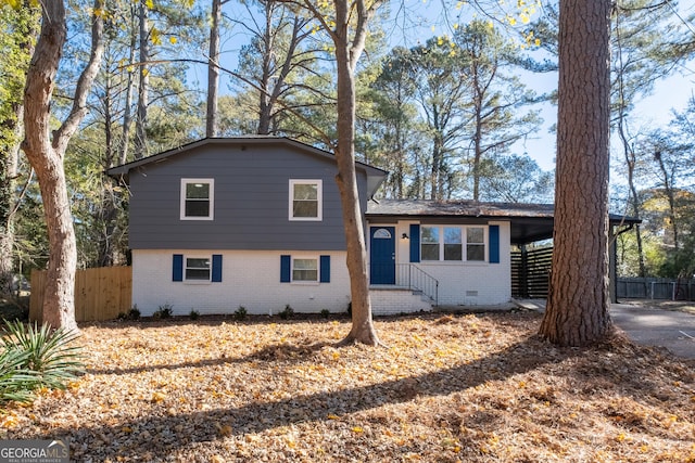 split level home featuring a carport