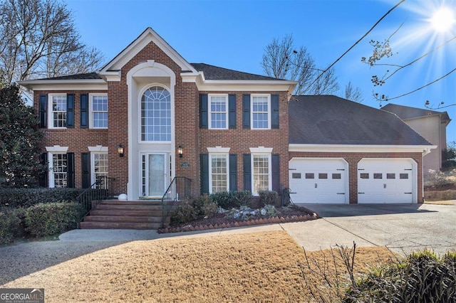 colonial inspired home with a garage