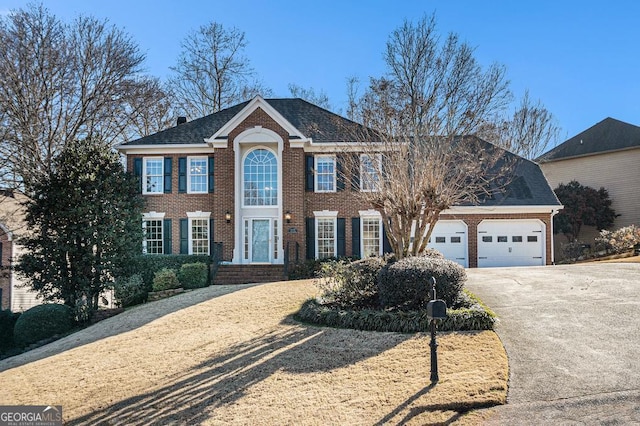 colonial house featuring a garage