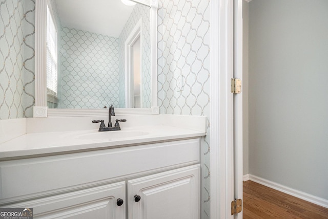 bathroom featuring wood-type flooring and vanity