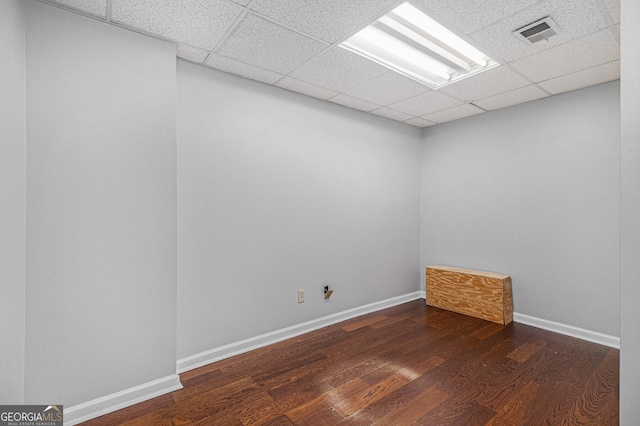 unfurnished room with dark hardwood / wood-style floors