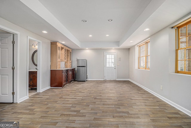 interior space featuring sink and light wood-type flooring