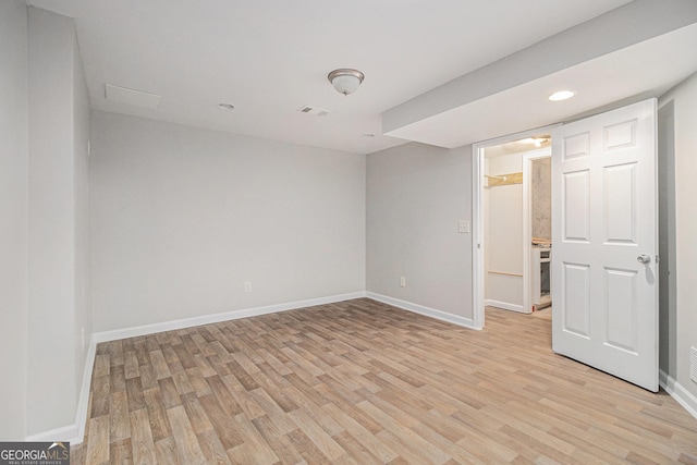 unfurnished room featuring light wood-type flooring