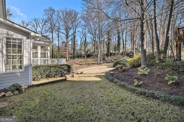 view of yard with a sunroom