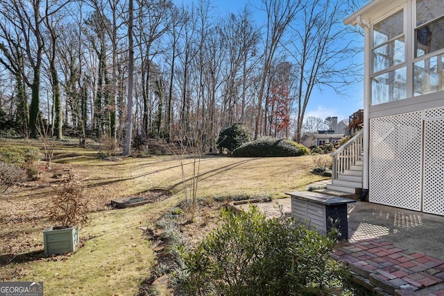 view of yard with a sunroom